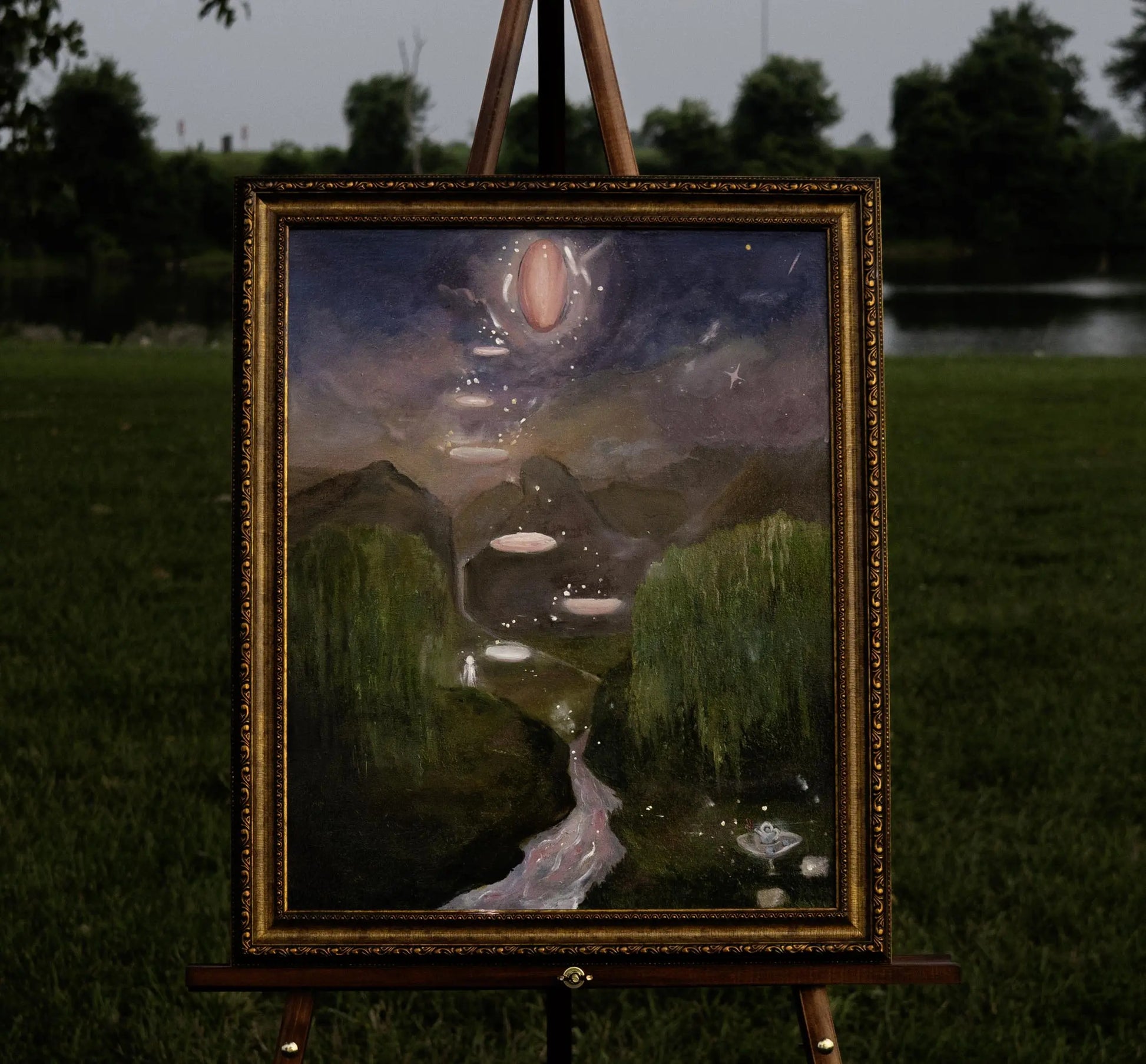 Surreal landscape featuring a lush green valley flanked by drooping willow trees, leading to distant mountains under a cosmic sky. Pink, glowing pools float upward into the clouds, culminating in a large luminous orb. A small white figure stands near the base, adding a sense of scale and mystery.